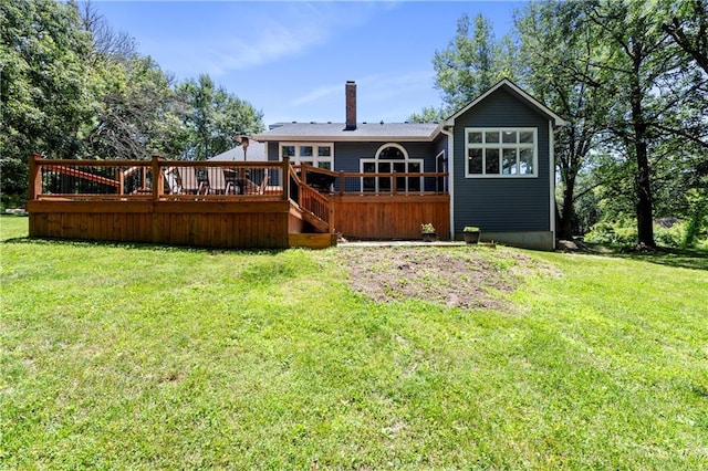 414 N 4th St, Gower, MO 64454 - back of house with a chimney, a wooden deck, and a lawn