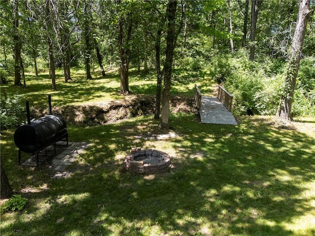 414 N 4th St, Gower, MO 64454 - view of green lawn featuring an outdoor fire pit