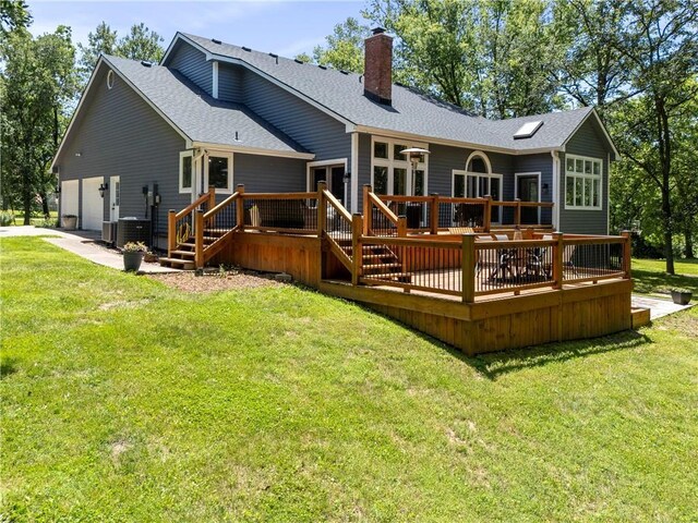 414 N 4th St, Gower, MO 64454 - rear view of property featuring a chimney, a wooden deck, a garage, and a shingled roof