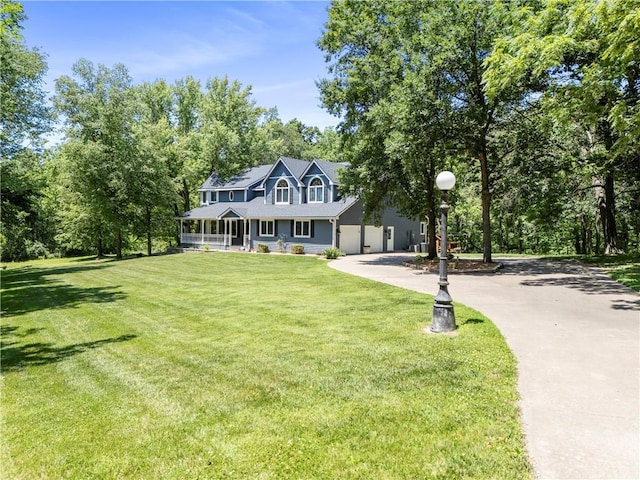 414 N 4th St, Gower, MO 64454 - view of front of property featuring a porch, concrete driveway, and a front yard