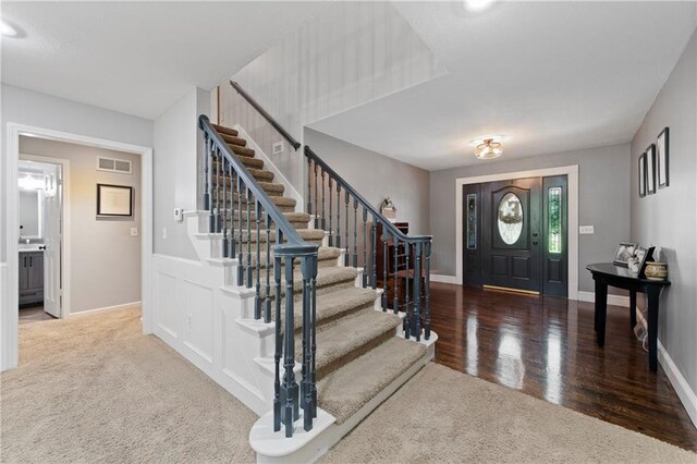 414 N 4th St, Gower, MO 64454 - carpeted foyer entrance featuring stairway and wood finished floors