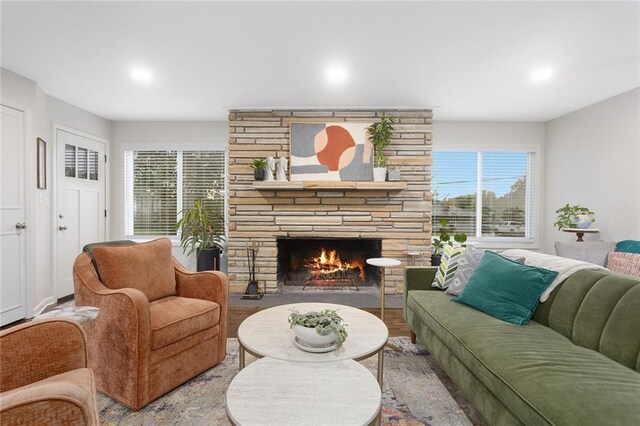 1304 Nashua Rd, Liberty, MO 64068 - living room featuring a stone fireplace