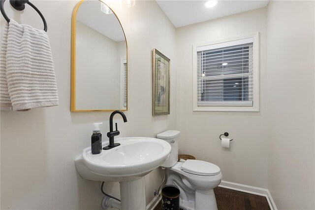 1304 Nashua Rd, Liberty, MO 64068 - half bath featuring baseboards and wood finished floors
