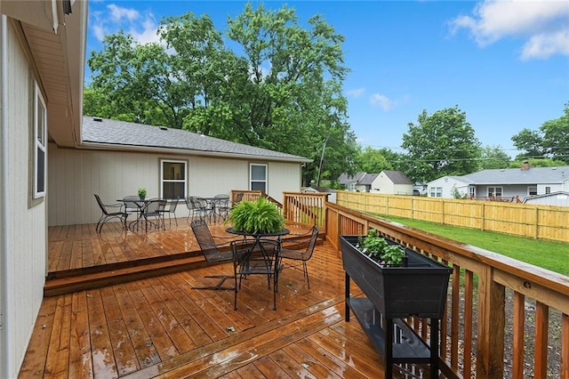 1304 Nashua Rd, Liberty, MO 64068 - wooden terrace featuring outdoor dining area and a fenced backyard