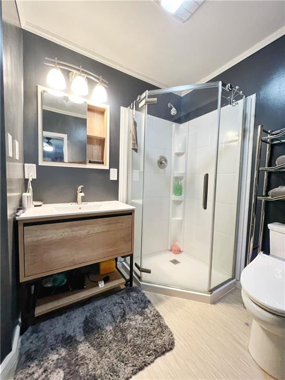 3342 Duncan St, Saint Joseph, MO 64507 - bathroom with ornamental molding, wood finished floors, a shower stall, and vanity