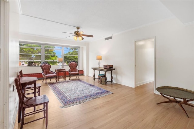 333 W Meyer Blvd # 212, Kansas City, MO 64113 - living area with crown molding, wood finished floors, and a ceiling fan