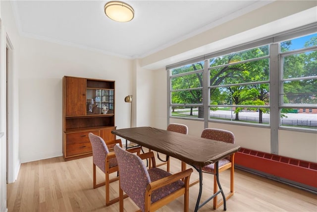 333 W Meyer Blvd # 212, Kansas City, MO 64113 - dining room featuring light wood finished floors and crown molding