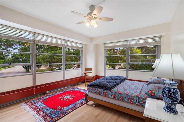 333 W Meyer Blvd # 212, Kansas City, MO 64113 - bedroom featuring wood finished floors and a ceiling fan