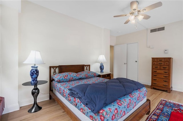 333 W Meyer Blvd # 212, Kansas City, MO 64113 - bedroom featuring wood finished floors and ceiling fan