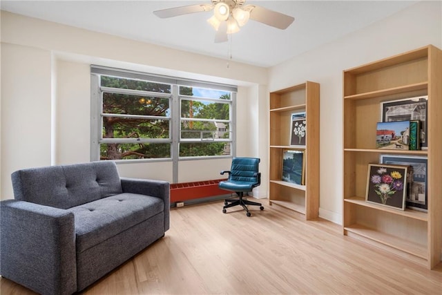 333 W Meyer Blvd # 212, Kansas City, MO 64113 - living area with wood finished floors, ceiling fan, and built in features
