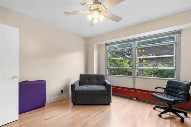 333 W Meyer Blvd # 212, Kansas City, MO 64113 - living area featuring wood finished floors and a ceiling fan