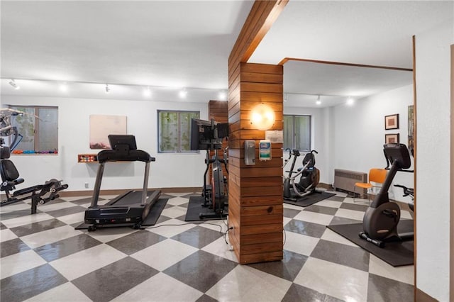 333 W Meyer Blvd # 212, Kansas City, MO 64113 - exercise room with rail lighting, radiator, and tile patterned floors