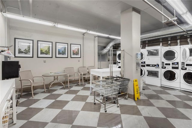 333 W Meyer Blvd # 212, Kansas City, MO 64113 - shared laundry room featuring stacked washer / dryer, tile patterned floors, and washing machine and clothes dryer