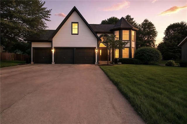 14712 Woodward St, Overland Park, KS 66223 - view of front of house featuring driveway and an attached garage
