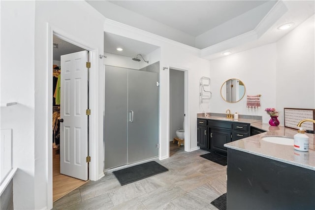 14712 Woodward St, Overland Park, KS 66223 - full bathroom with a stall shower, vanity, a spacious closet, and crown molding