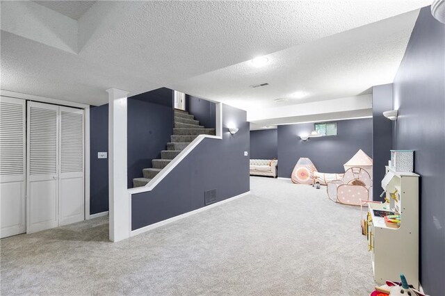 14712 Woodward St, Overland Park, KS 66223 - finished below grade area with carpet, a textured ceiling, and stairs