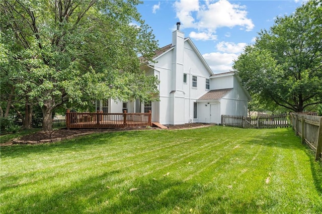 14712 Woodward St, Overland Park, KS 66223 - rear view of property with a chimney, a wooden deck, and a fenced backyard