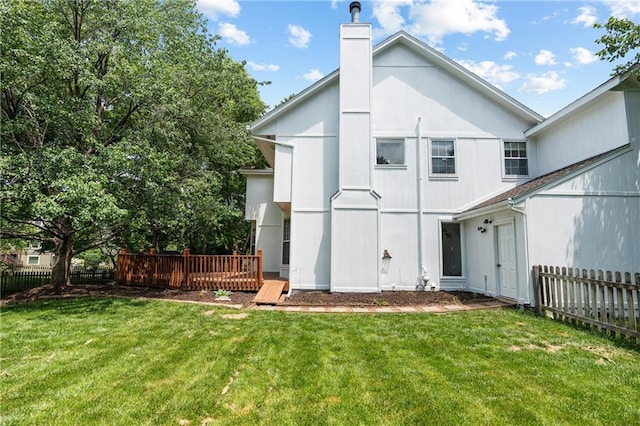 14712 Woodward St, Overland Park, KS 66223 - rear view of house featuring a chimney and a deck