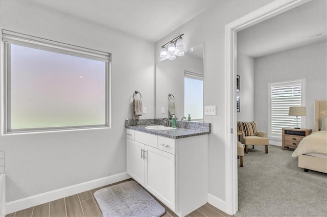 21404 W 47th Ter, Shawnee, KS 66218 - full bathroom featuring vanity, connected bathroom, and wood finished floors