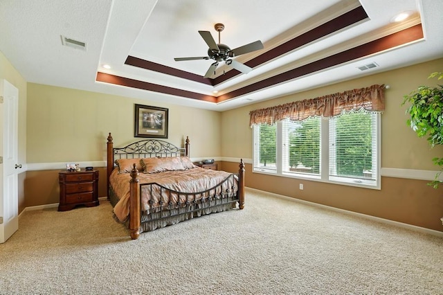 2312 NE Sweet Water Dr, Lees Summit, MO 64086 - bedroom featuring a raised ceiling, carpet, ceiling fan, and ornamental molding