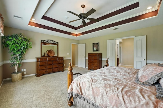2312 NE Sweet Water Dr, Lees Summit, MO 64086 - carpeted bedroom featuring a tray ceiling, ornamental molding, and ceiling fan