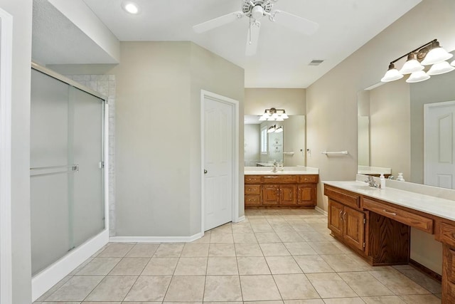 2312 NE Sweet Water Dr, Lees Summit, MO 64086 - full bath featuring a shower stall, two vanities, a ceiling fan, and tile patterned flooring