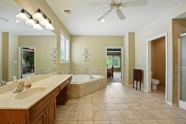 2312 NE Sweet Water Dr, Lees Summit, MO 64086 - full bath with a ceiling fan, a stall shower, vanity, tile patterned flooring, and a garden tub