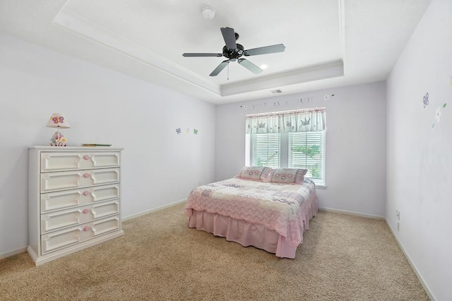 2312 NE Sweet Water Dr, Lees Summit, MO 64086 - carpeted bedroom with a raised ceiling and a ceiling fan