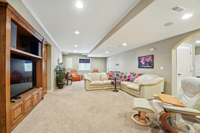 2312 NE Sweet Water Dr, Lees Summit, MO 64086 - carpeted living area featuring recessed lighting, arched walkways, and crown molding