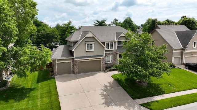 2312 NE Sweet Water Dr, Lees Summit, MO 64086 - craftsman-style house with driveway, a front yard, stucco siding, and brick siding