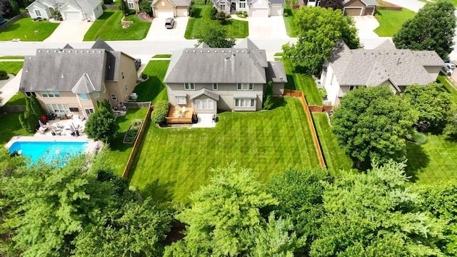 2312 NE Sweet Water Dr, Lees Summit, MO 64086 - aerial perspective of suburban area featuring a pool area