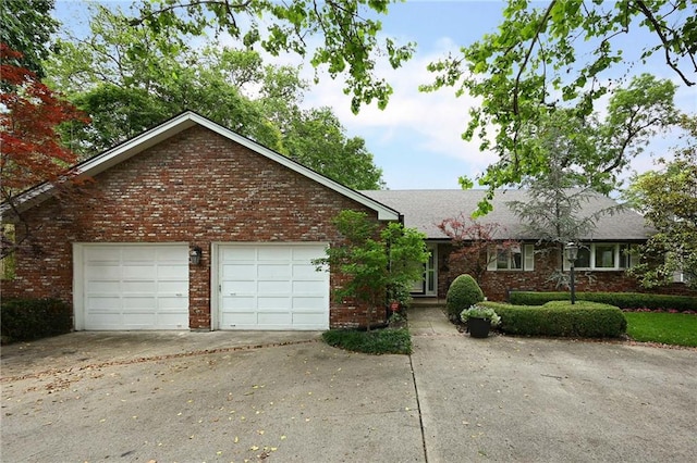 490 W 49th Ter, Kansas City, MO 64112 - ranch-style home featuring driveway, brick siding, and a garage
