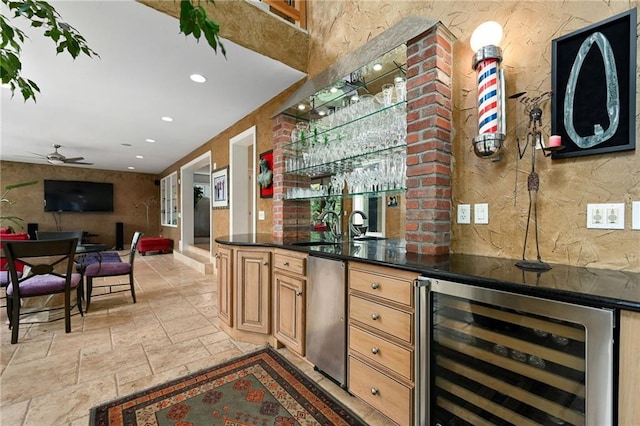 490 W 49th Ter, Kansas City, MO 64112 - indoor wet bar with wine cooler, stone tile floors, recessed lighting, and ceiling fan