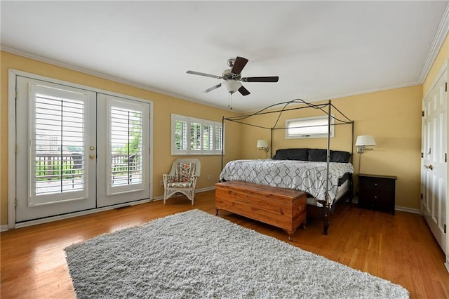 490 W 49th Ter, Kansas City, MO 64112 - bedroom with ornamental molding, access to exterior, wood finished floors, french doors, and a ceiling fan