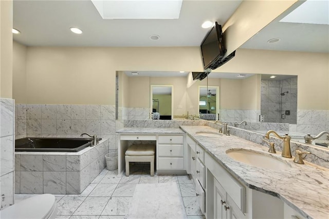 490 W 49th Ter, Kansas City, MO 64112 - full bath with a bath, double vanity, recessed lighting, a stall shower, and marble finish floors