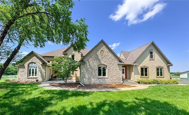 26528-23.09 S Metcalf Rd, Louisburg, KS 66053 - view of front facade with stone siding and a front lawn