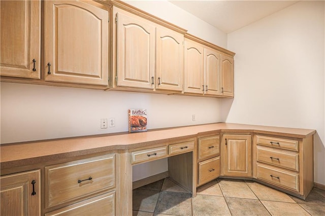 26528-23.09 S Metcalf Rd, Louisburg, KS 66053 - unfurnished office featuring built in desk and light tile patterned floors