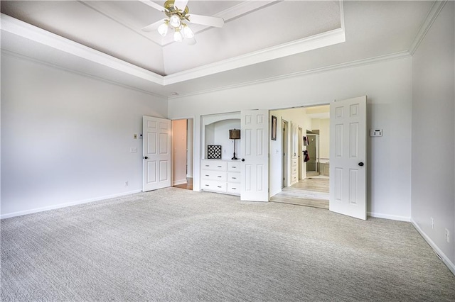 26528-23.09 S Metcalf Rd, Louisburg, KS 66053 - unfurnished bedroom featuring light colored carpet, a tray ceiling, ornamental molding, and a ceiling fan