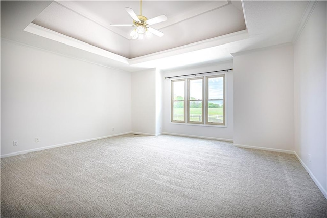 26528-23.09 S Metcalf Rd, Louisburg, KS 66053 - unfurnished room featuring a raised ceiling, carpet flooring, a ceiling fan, and ornamental molding