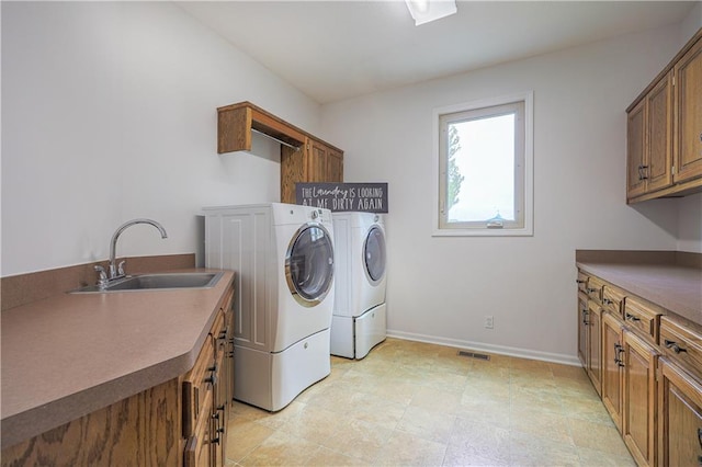 26528-23.09 S Metcalf Rd, Louisburg, KS 66053 - laundry room featuring cabinet space and washer and clothes dryer