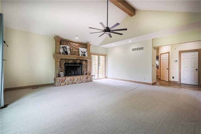 26528-23.09 S Metcalf Rd, Louisburg, KS 66053 - unfurnished living room featuring carpet floors, a ceiling fan, beam ceiling, a stone fireplace, and high vaulted ceiling