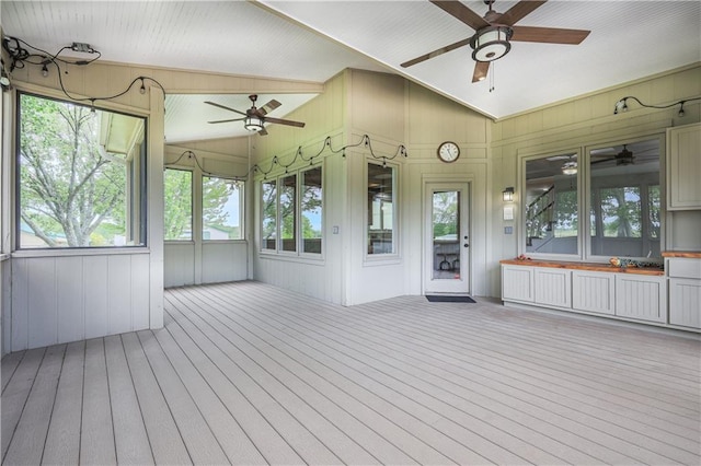 26528-23.09 S Metcalf Rd, Louisburg, KS 66053 - unfurnished sunroom with a ceiling fan, vaulted ceiling, and plenty of natural light