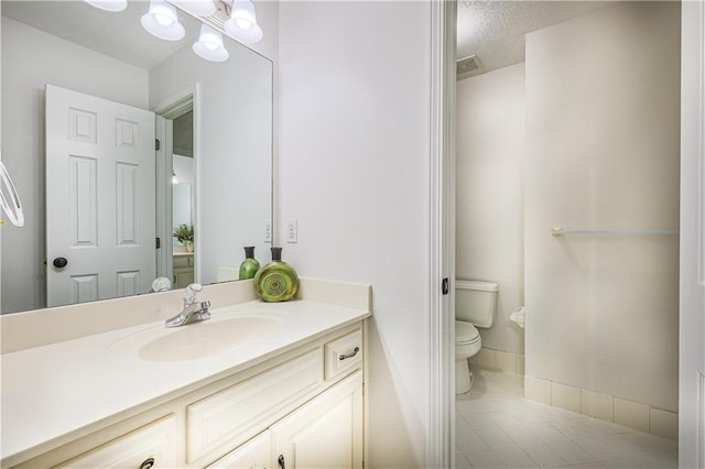 26528-23.09 S Metcalf Rd, Louisburg, KS 66053 - bathroom with tile patterned floors, vanity, and a textured ceiling