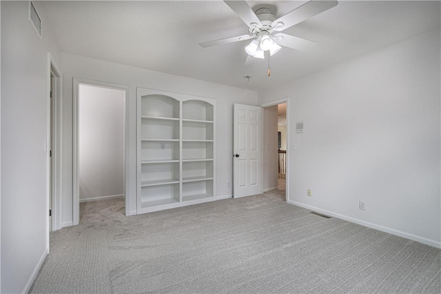 26528-23.09 S Metcalf Rd, Louisburg, KS 66053 - unfurnished bedroom featuring carpet flooring and ceiling fan