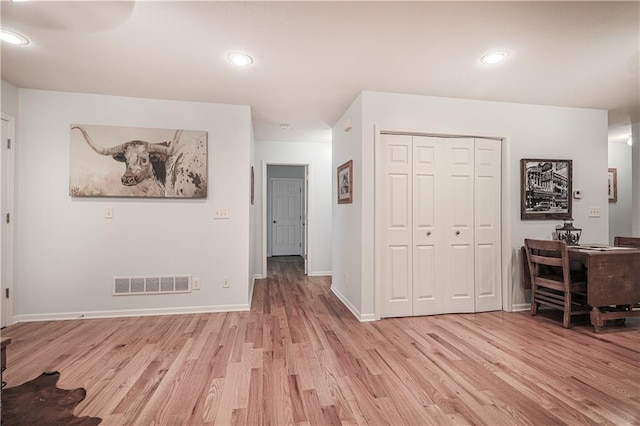 26528-23.09 S Metcalf Rd, Louisburg, KS 66053 - living room featuring light wood-type flooring and recessed lighting