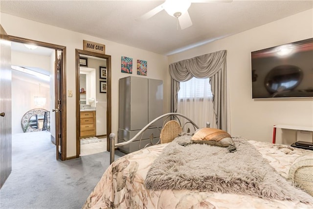 10902 W 96th Ter, Overland Park, KS 66214 - bedroom with light carpet, ceiling fan, and connected bathroom