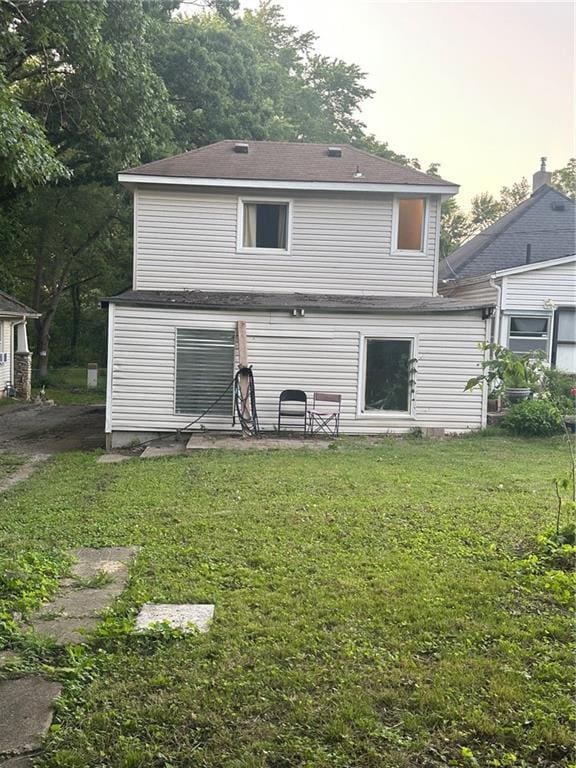 3823 Ruby Ave, Kansas City, KS 66106 - back of house with a lawn