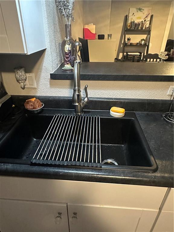 3823 Ruby Ave, Kansas City, KS 66106 - kitchen view of dark countertops