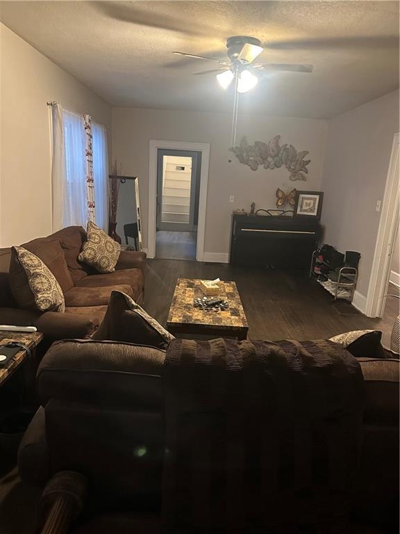 3823 Ruby Ave, Kansas City, KS 66106 - living area with ceiling fan and wood finished floors