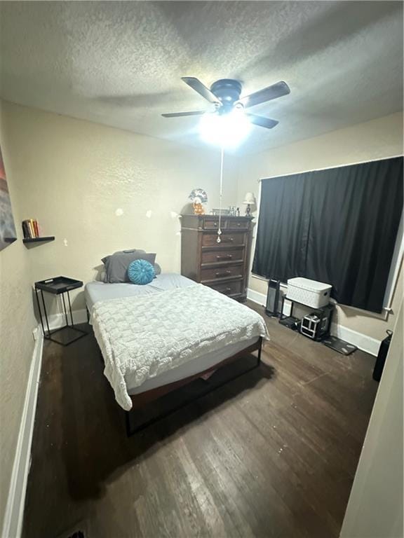 3823 Ruby Ave, Kansas City, KS 66106 - bedroom featuring a textured ceiling, wood finished floors, and ceiling fan